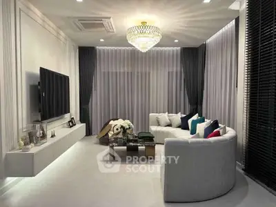 Luxurious living room with elegant chandelier and modern decor