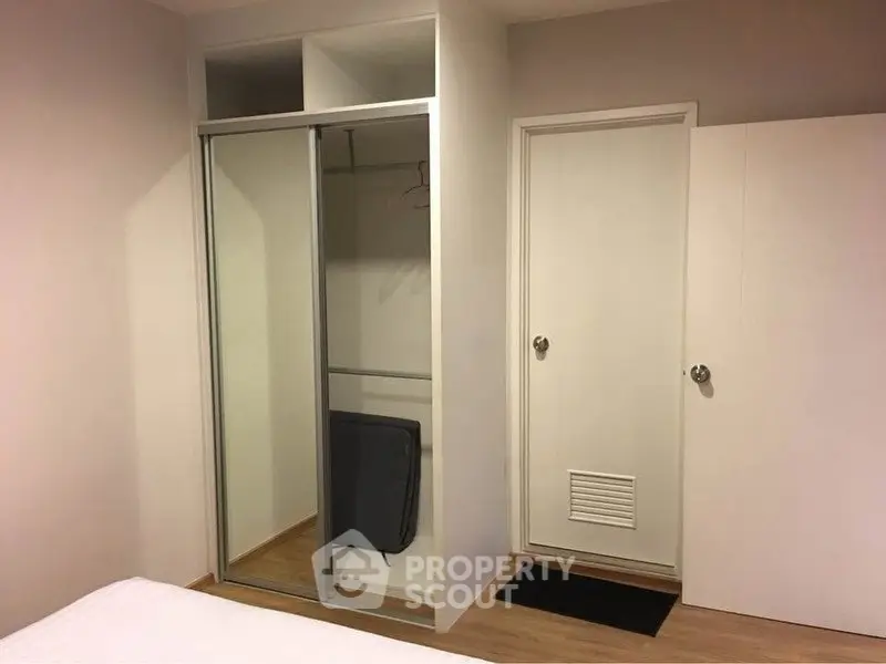 Modern bedroom with built-in sliding wardrobe and minimalist design