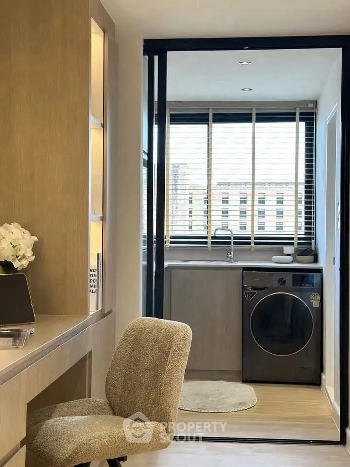 Modern study area with washing machine and large window view