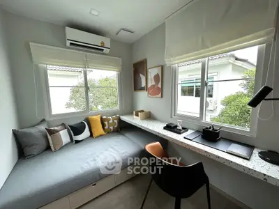 Stylish study room with modern decor and large windows for natural light