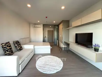 Modern living room with sleek furniture and stylish decor in a contemporary apartment.