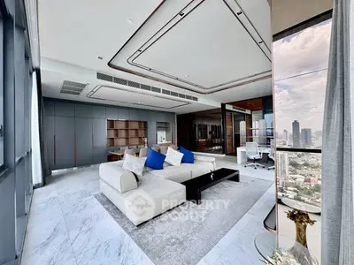 Luxurious modern living room with panoramic city view and elegant furnishings.