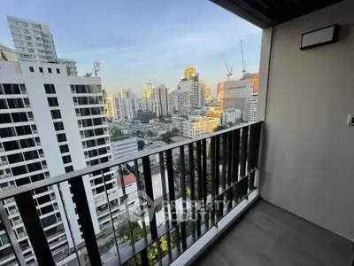 Stunning city view from modern apartment balcony in urban high-rise building.