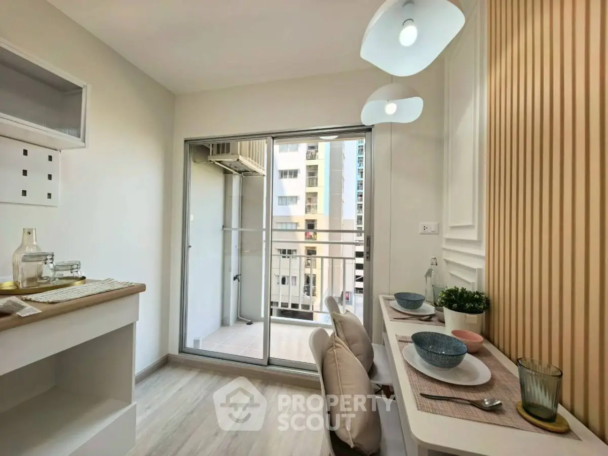 Modern dining area with balcony view in a stylish apartment