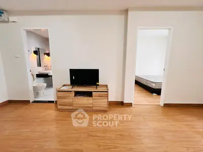 Spacious apartment interior with modern wooden flooring and open layout
