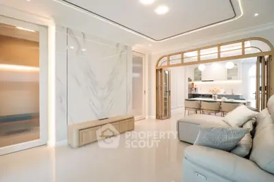 Luxurious open-plan living room with modern design and elegant dining area