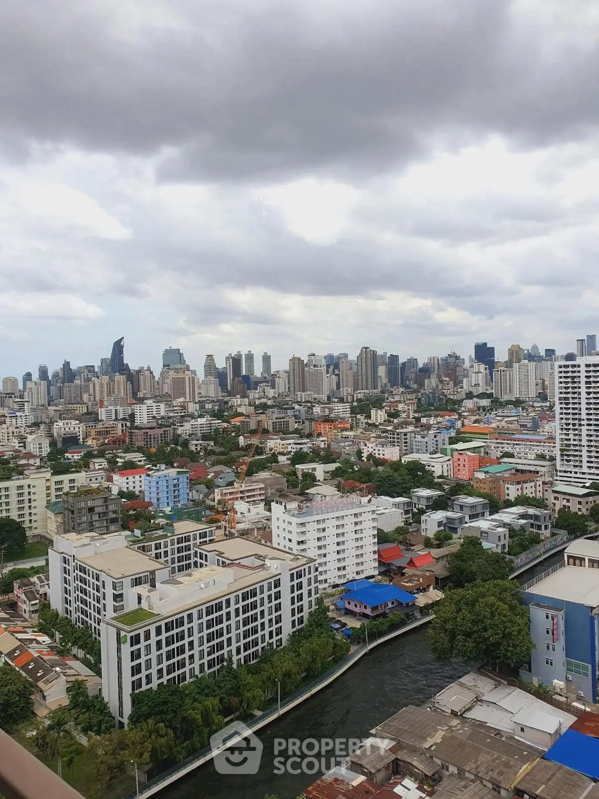 Stunning cityscape view showcasing urban skyline and river, perfect for real estate investment.