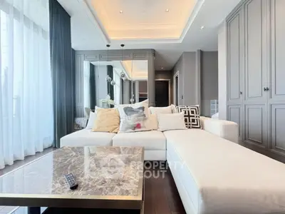 Luxurious modern living room with elegant decor and spacious seating area.