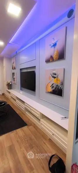 Modern living room with stylish wall art and ambient lighting