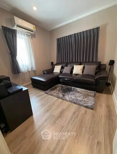 Cozy living room with modern decor and plush seating