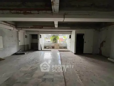 Spacious unfinished interior with potential for customization and renovation.