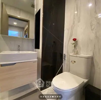 Modern bathroom with sleek fixtures and elegant marble walls