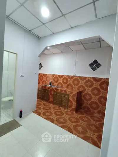 Spacious kitchen with unique tile design and open layout