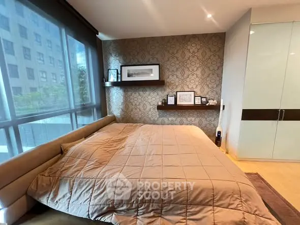 Luxurious bedroom with modern decor and large window view