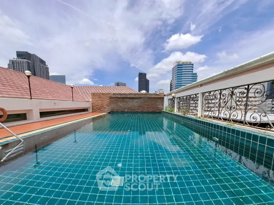 Stunning rooftop pool with city skyline views, perfect for relaxation and leisure.