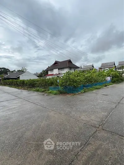 Charming residential neighborhood with traditional architecture and lush greenery, perfect for serene living.