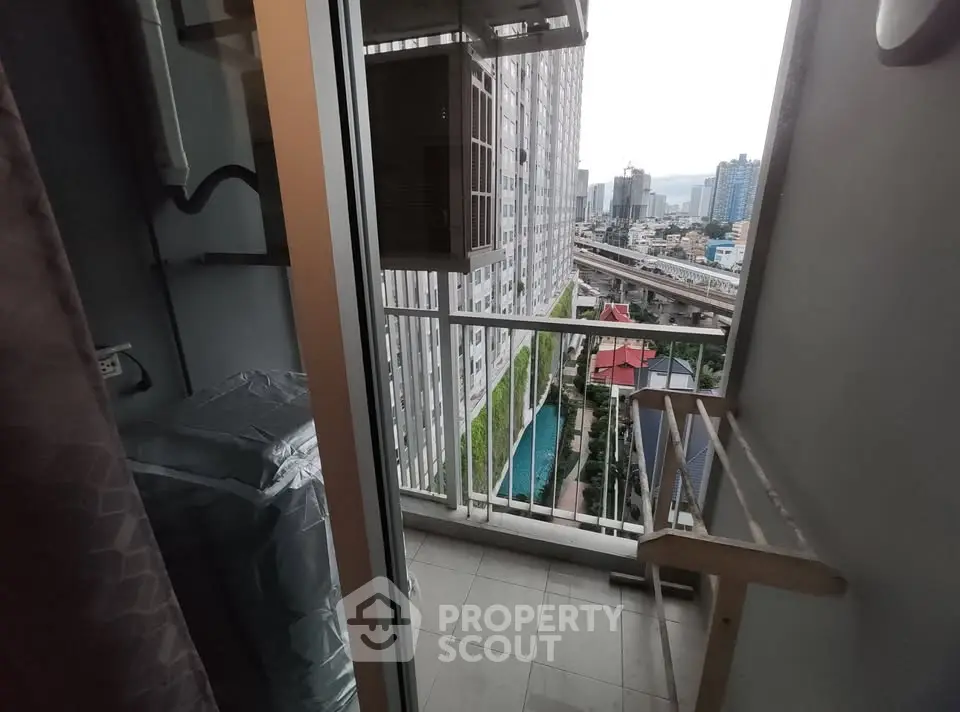 Charming balcony with city view, perfect for relaxation and enjoying urban scenery.