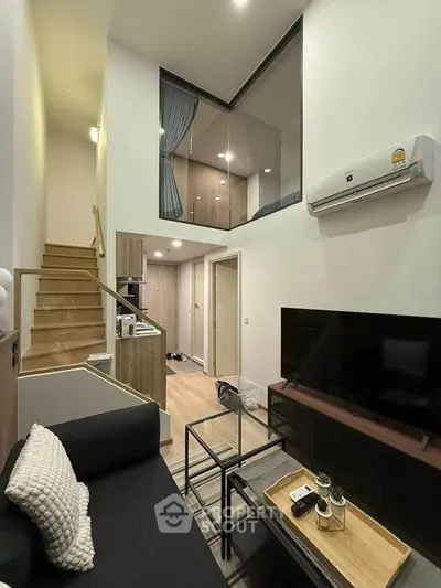 Modern duplex living room with high ceiling and stylish decor