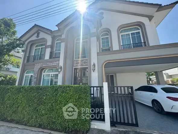 Elegant two-story house with modern design and attached garage in a serene neighborhood.