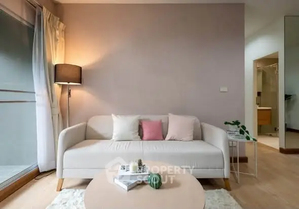 Cozy living room with modern sofa and soft lighting, perfect for relaxation.