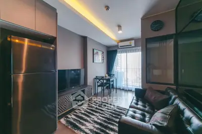 Modern living room with sleek furniture and natural light, featuring a cozy seating area and stylish decor.