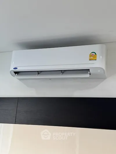 Modern air conditioning unit installed on a sleek interior wall, enhancing home comfort and energy efficiency.