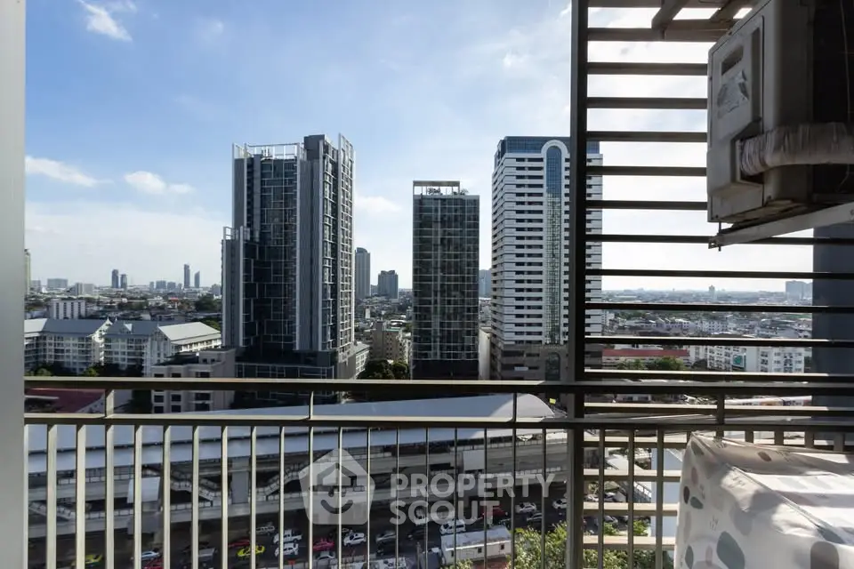 Stunning cityscape view from high-rise balcony with modern skyscrapers