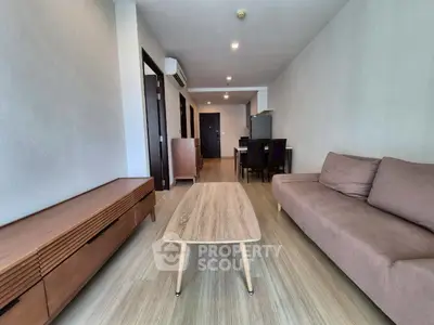 Spacious modern living room with sleek furniture and open layout