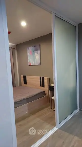 Modern bedroom with sliding glass door and stylish decor