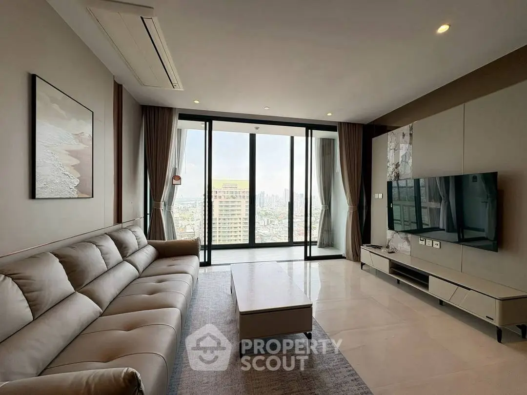 Spacious modern living room with city view, elegant furnishings, and large windows for natural light.
