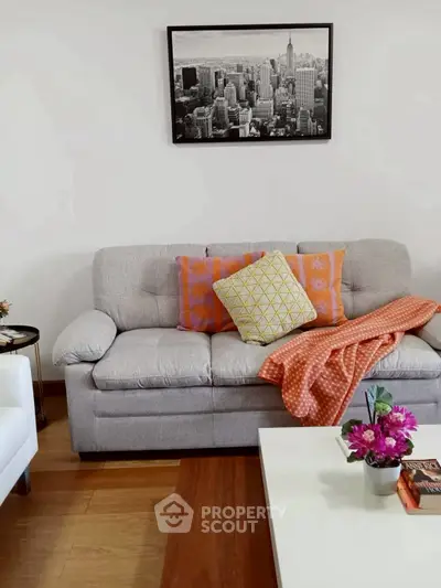 Cozy living room with stylish decor and comfortable seating, perfect for relaxation.