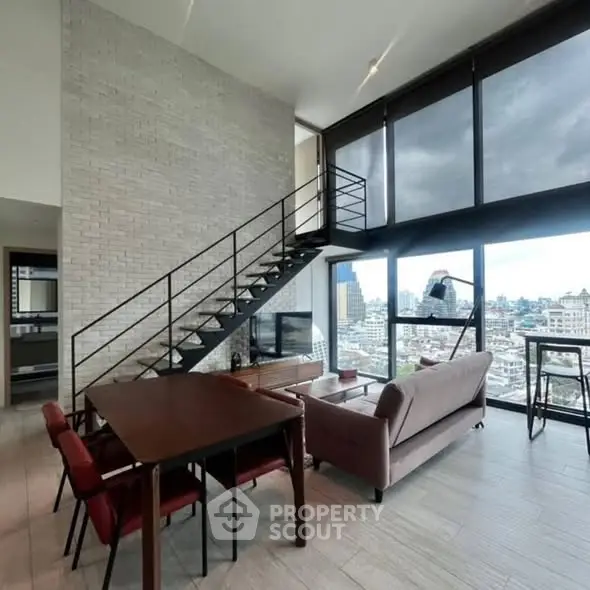 Stunning modern living room with city view, high ceilings, and stylish staircase.