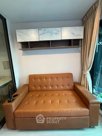 Modern living room with stylish brown sofa and elegant wall-mounted shelves