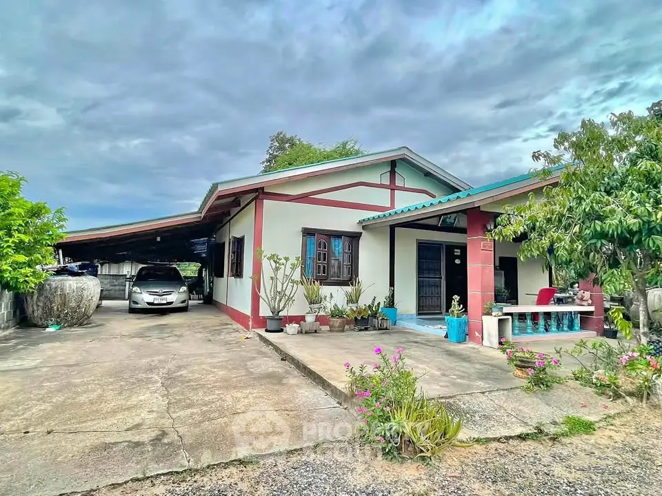 Charming single-story home with carport and lush garden, perfect for family living.