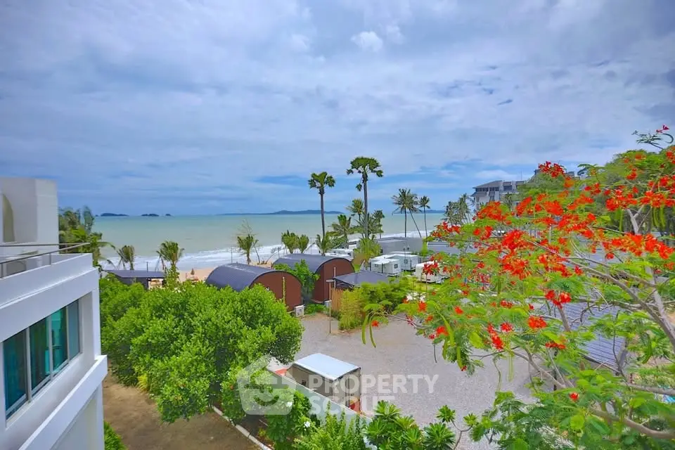 Stunning beachfront property with ocean view and lush greenery