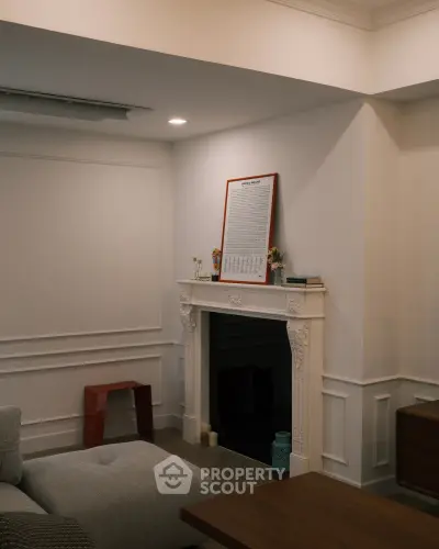 Chic living room with elegant fireplace and modern decor, perfect for cozy gatherings.