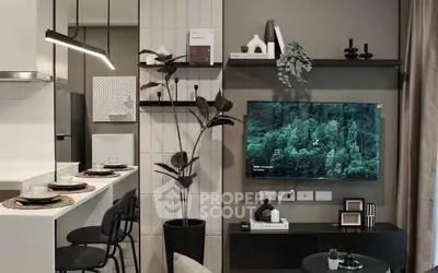 Modern living room with stylish decor and wall-mounted TV, featuring sleek furniture and elegant lighting.