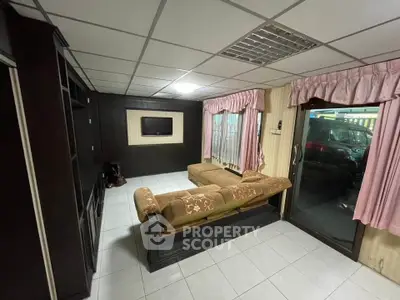 Spacious living room with elegant furniture and large windows for natural light.