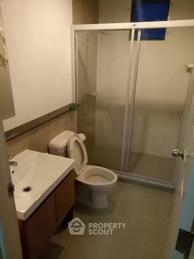 Modern bathroom with glass shower and sleek fixtures