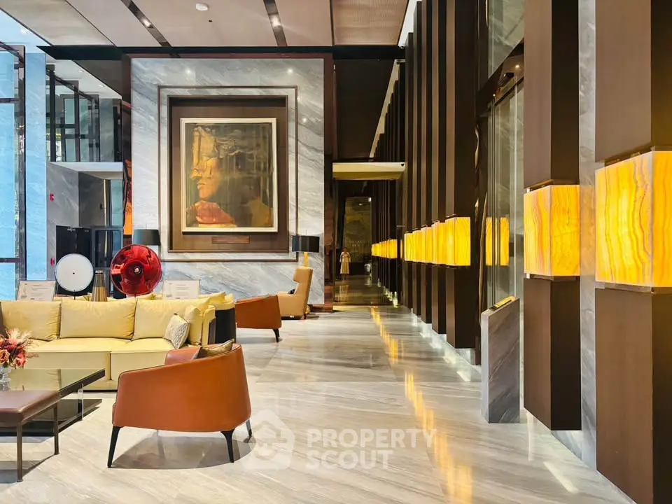 Luxurious hotel lobby with elegant seating and modern art decor