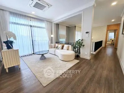 Luxurious living room with elegant decor and large windows in modern apartment
