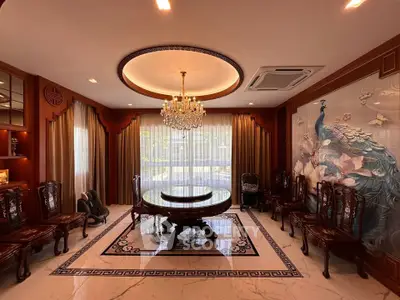 Luxurious living room with elegant chandelier and ornate furniture