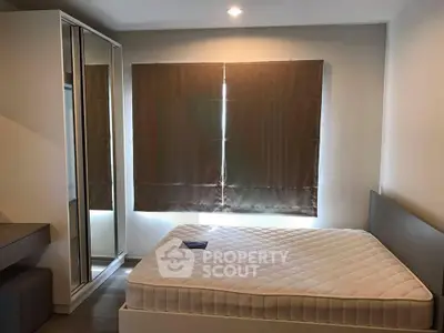 Modern bedroom with sleek design and ample natural light