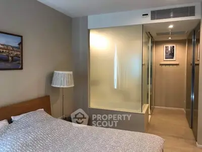 Modern bedroom with frosted glass partition and stylish decor