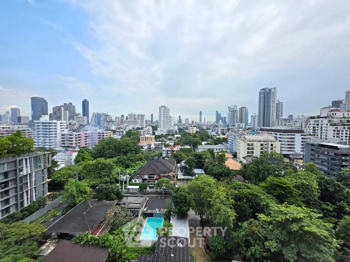Stunning cityscape view with lush greenery and modern skyline, perfect for urban living.