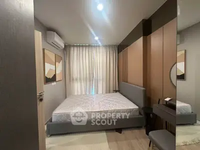 Modern bedroom with stylish decor and natural light