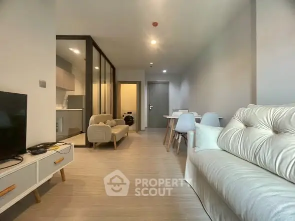 Modern living room with open layout and stylish furniture in a contemporary apartment.