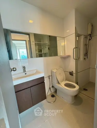 Modern bathroom with sleek fixtures and glass shower enclosure