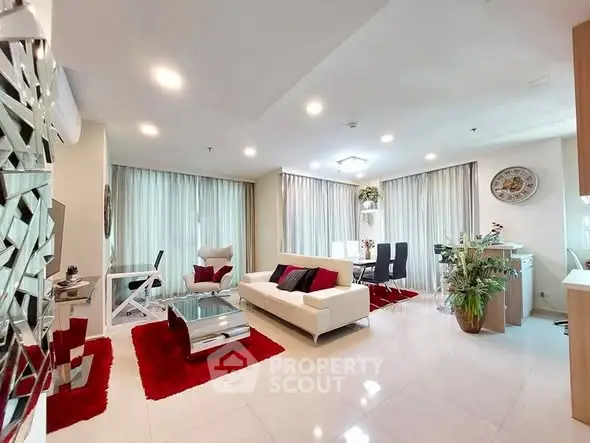 Spacious modern living room with elegant decor and ample natural light.