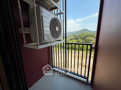 Charming balcony with scenic view, perfect for relaxation and enjoying nature's beauty.